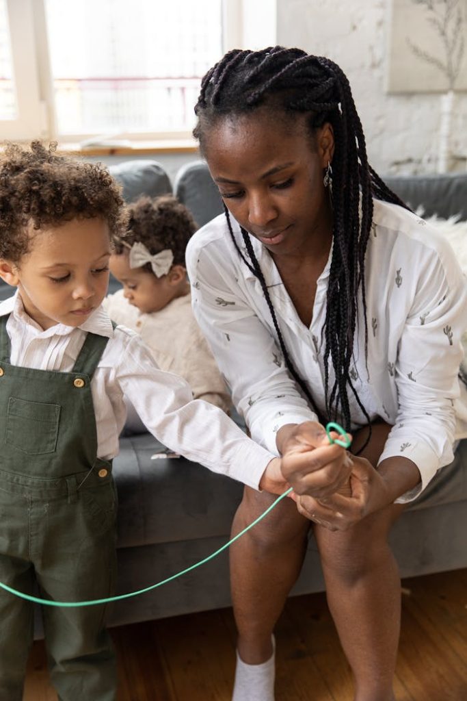 pexels-photo-4868385 Mother Sitting with Children